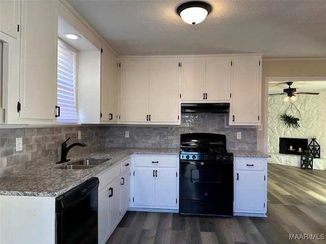 kitchen featuring sink, light stone counters, black appliances, dark hardwood / wood-style flooring, and white cabinets