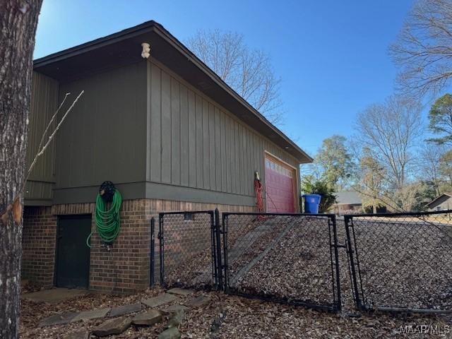 view of side of property with a garage