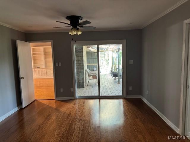 unfurnished room with ceiling fan, ornamental molding, and hardwood / wood-style flooring