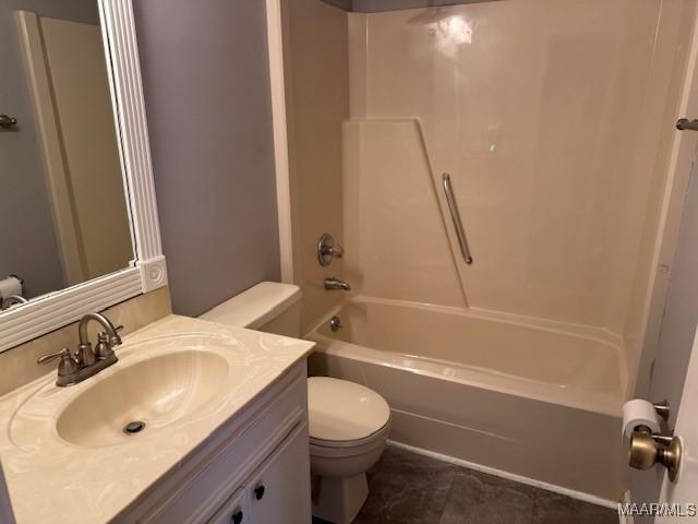 full bathroom with shower / bathing tub combination, vanity, tile patterned flooring, and toilet