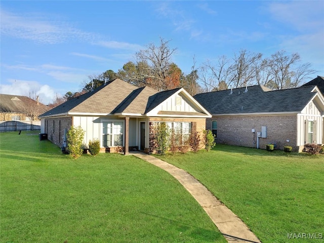 back of house featuring a lawn