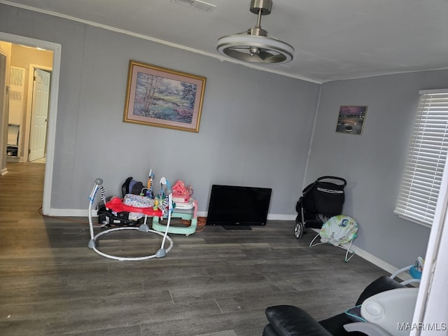 dining room featuring dark hardwood / wood-style flooring and ornamental molding