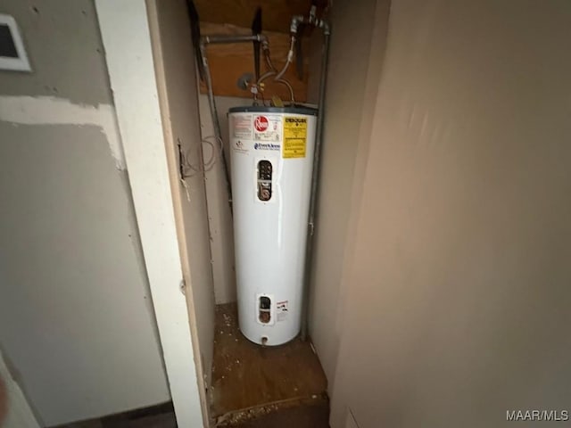 utility room featuring electric water heater