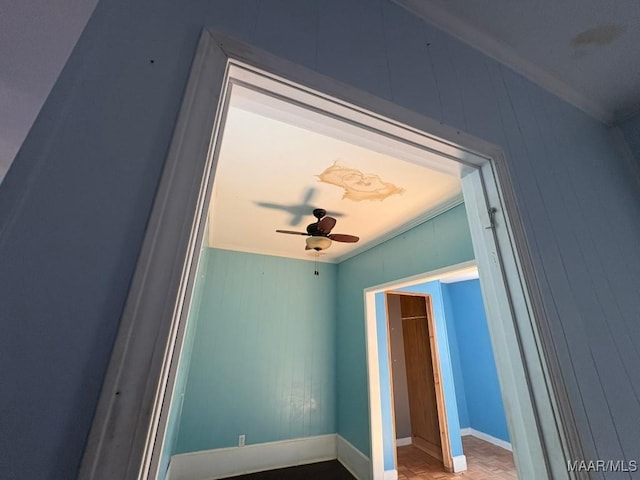 interior details with ceiling fan and parquet flooring