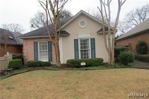 view of front of home with a front lawn