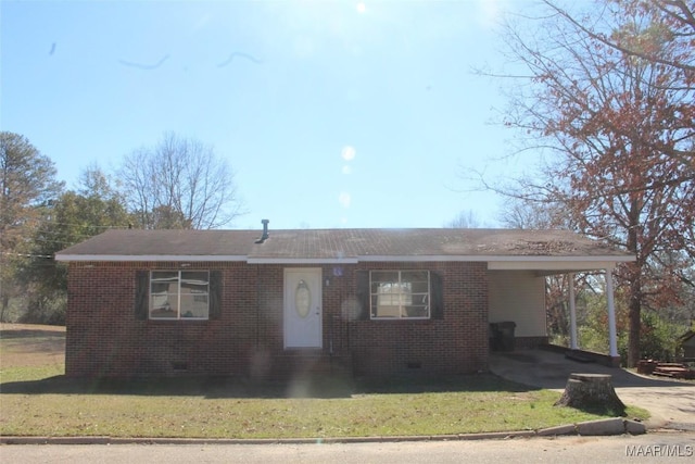 ranch-style house with a front lawn and a carport