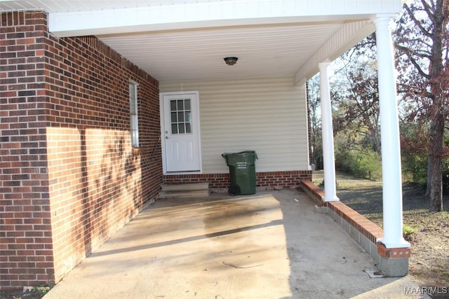 610 Thames St, Greenville, AL 36037 - view of exterior entry with a carport