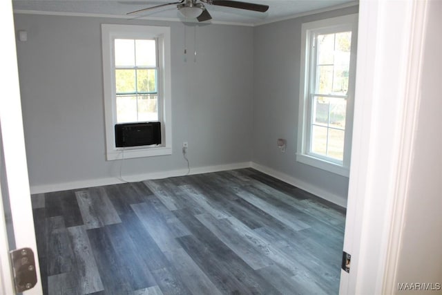 empty room featuring dark wood-type flooring, ornamental molding, cooling unit, and ceiling fan