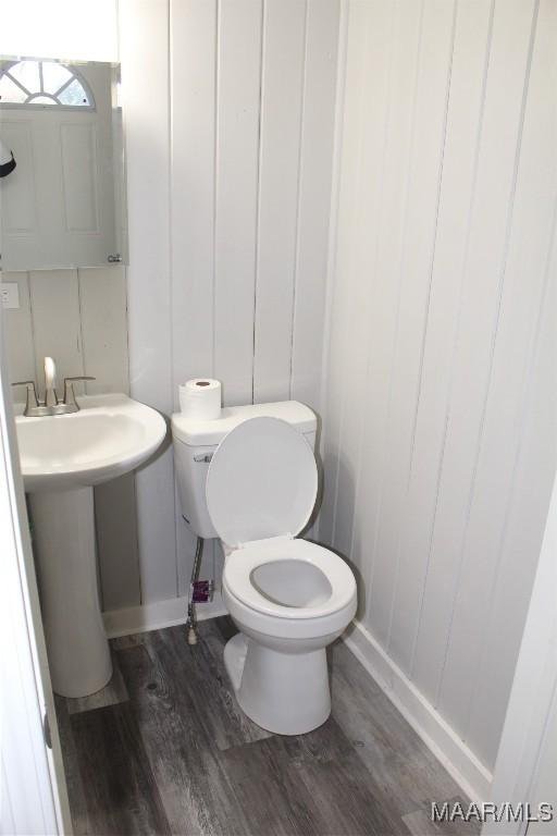 bathroom featuring toilet and hardwood / wood-style floors