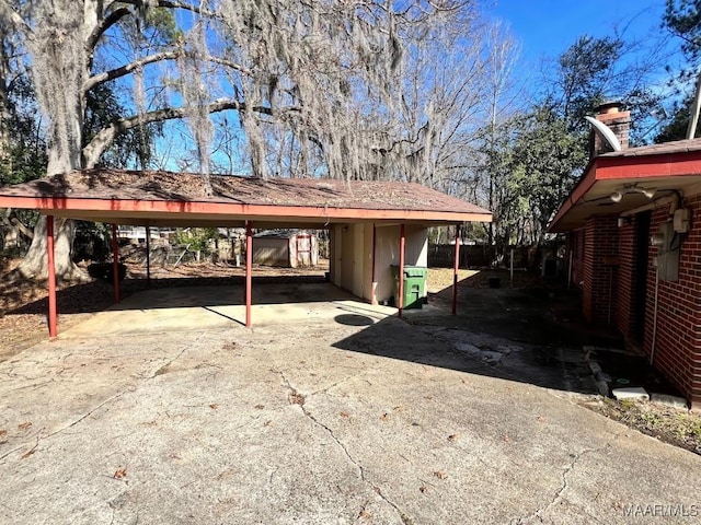 view of parking / parking lot with a carport