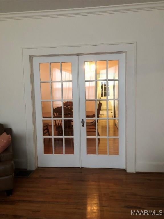 entryway with french doors, ornamental molding, and dark hardwood / wood-style flooring