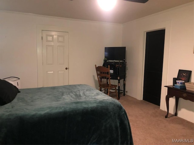 carpeted bedroom with ornamental molding