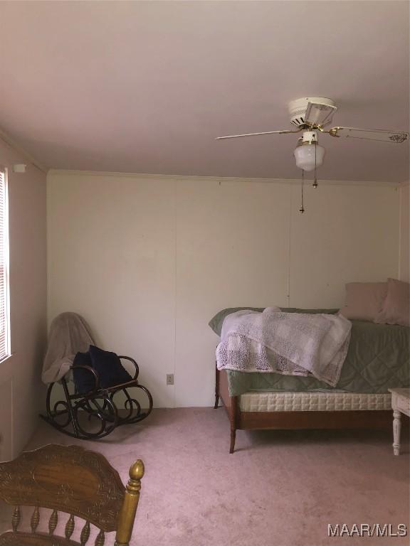 carpeted bedroom with ceiling fan