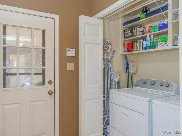 clothes washing area with washing machine and clothes dryer