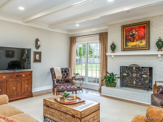 living room with a fireplace, light hardwood / wood-style flooring, beamed ceiling, and crown molding