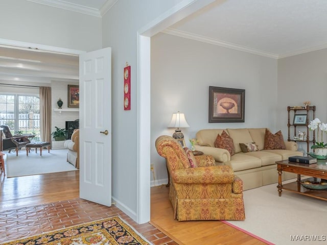 living room featuring a brick fireplace and crown molding