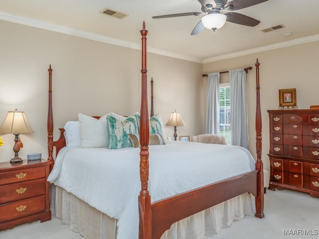 bedroom featuring ceiling fan, light colored carpet, and crown molding