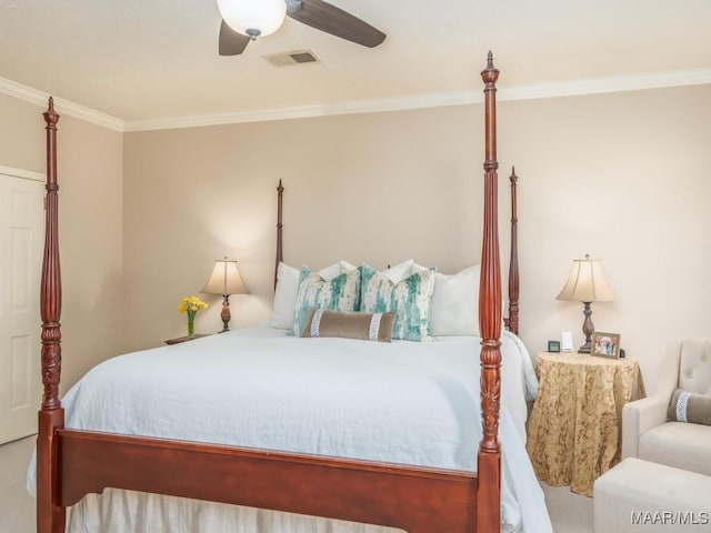 bedroom with ceiling fan and ornamental molding