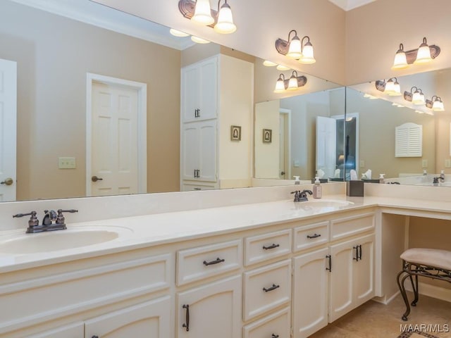 bathroom with ornamental molding, tile patterned floors, and vanity