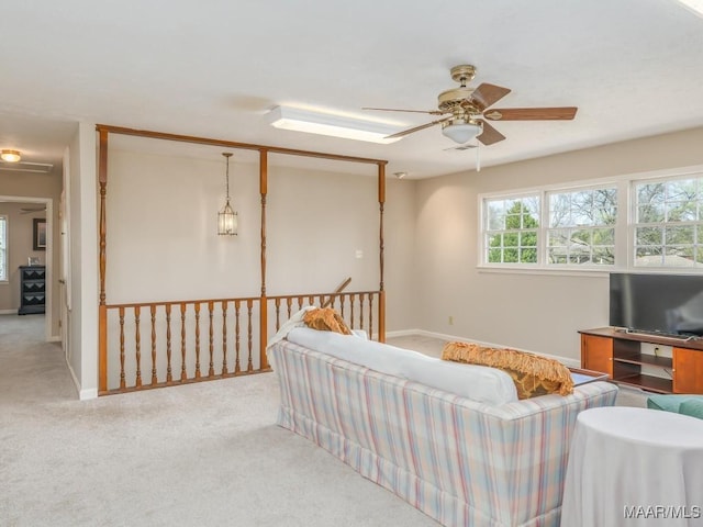 living room featuring ceiling fan and light carpet