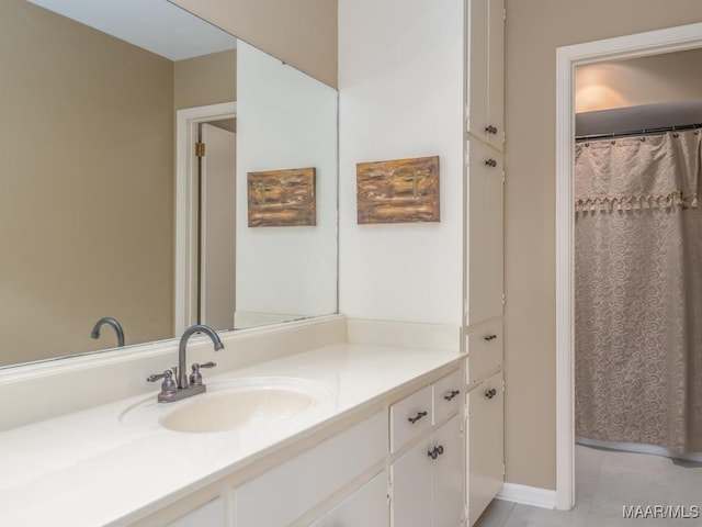 bathroom featuring vanity and tile patterned flooring