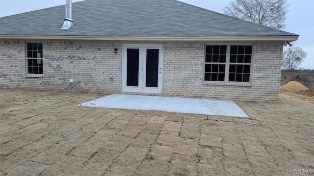 back of property with a patio