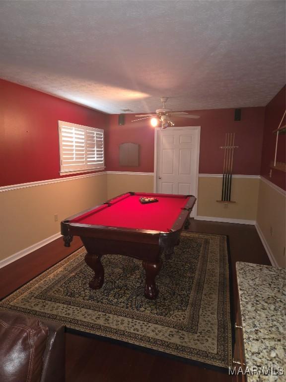 recreation room with ceiling fan, billiards, and a textured ceiling