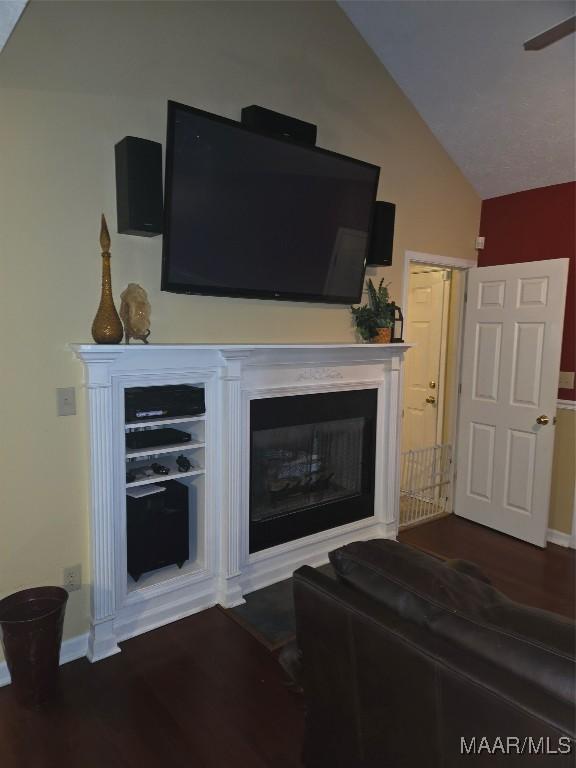 3601 Richardson Rd S, Hope Hull, AL 36043 - living area featuring wood finished floors, lofted ceiling, and a fireplace