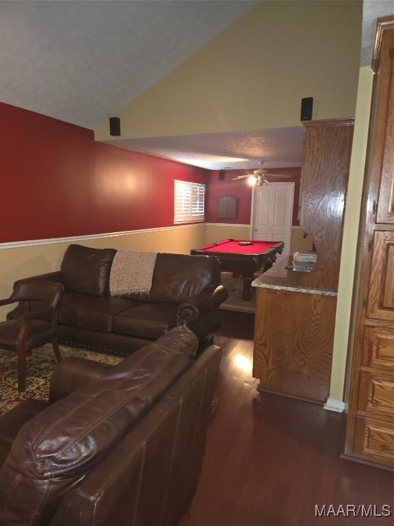 living room featuring ceiling fan, billiards, dark hardwood / wood-style flooring, and lofted ceiling