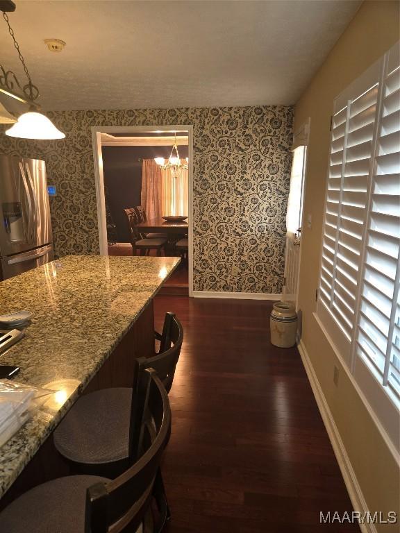 3601 Richardson Rd S, Hope Hull, AL 36043 - dining room featuring wallpapered walls, dark wood finished floors, and a chandelier