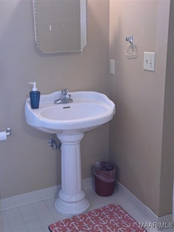 bathroom with tile patterned floors