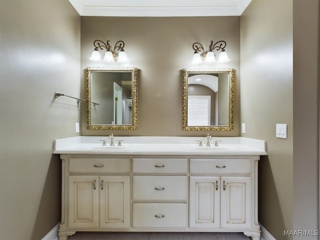 bathroom featuring ornamental molding and vanity