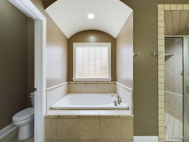 bathroom featuring shower with separate bathtub, lofted ceiling, and toilet