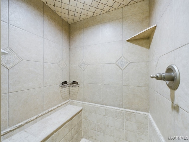 bathroom with tiled shower