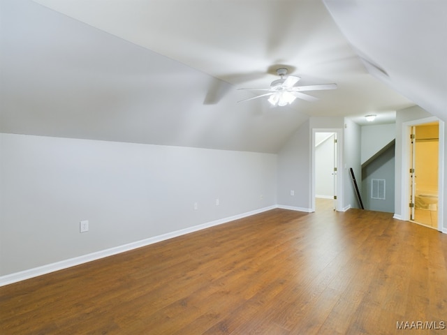 bonus room with hardwood / wood-style flooring, ceiling fan, and vaulted ceiling