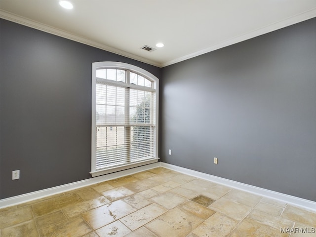 unfurnished room with crown molding