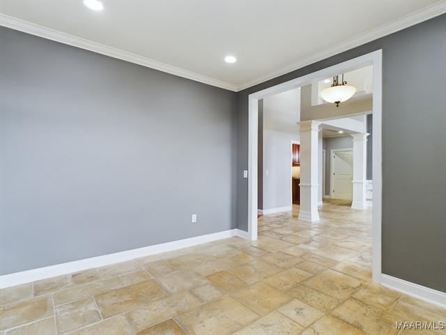 spare room featuring ornamental molding and decorative columns