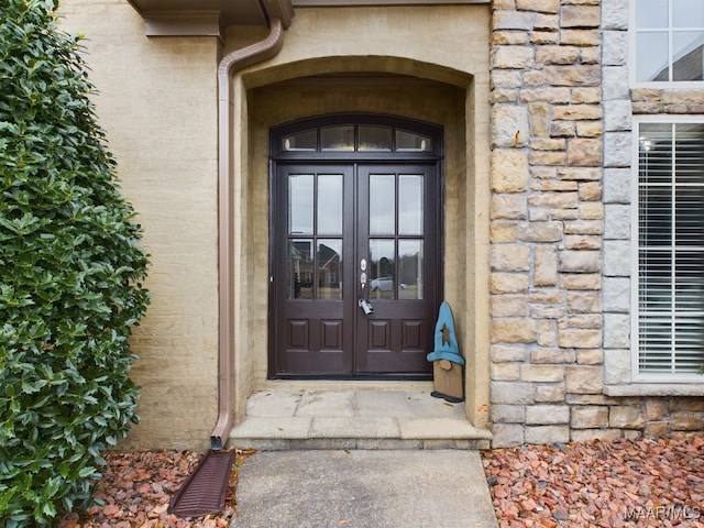 view of exterior entry featuring french doors