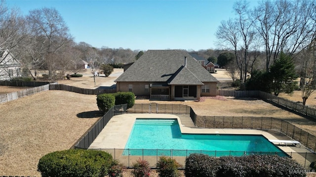 view of swimming pool with a patio area and a diving board