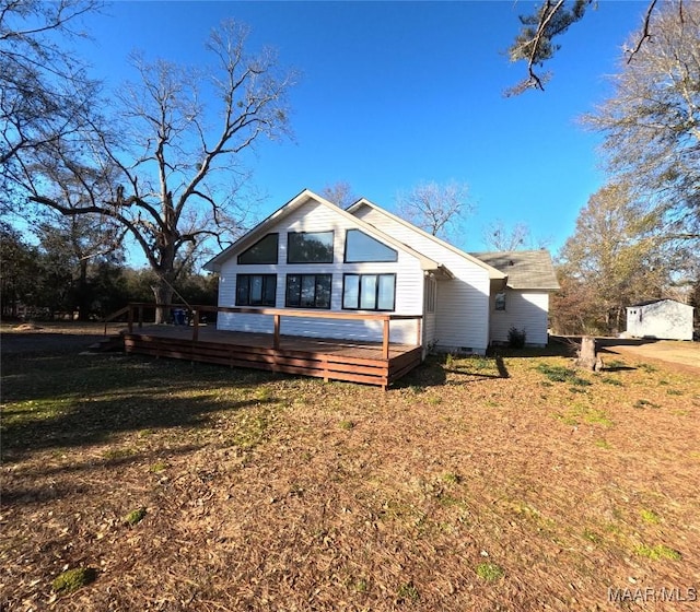 exterior space featuring a front yard and a deck