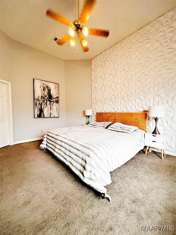 bedroom with ceiling fan and carpet flooring