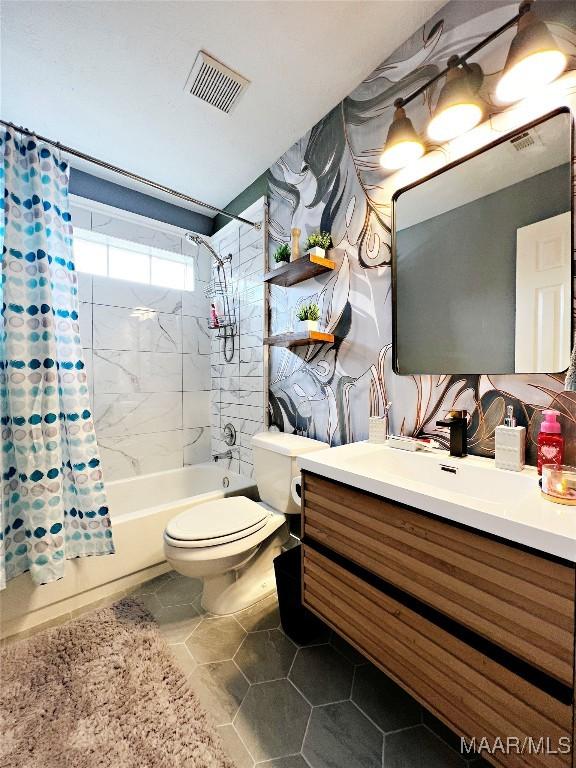 full bathroom featuring shower / bath combo, toilet, and vanity