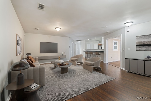 living room featuring dark wood-type flooring