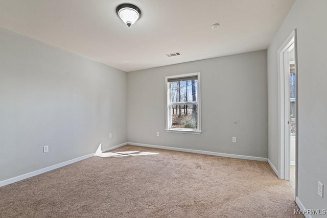 empty room with light colored carpet