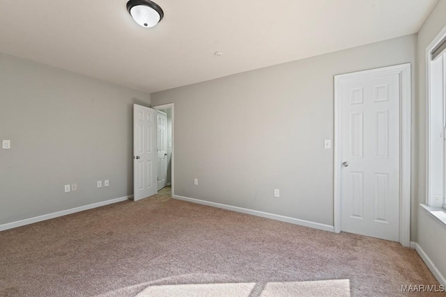 unfurnished bedroom with carpet floors