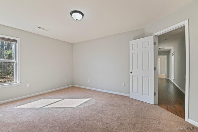 empty room featuring carpet flooring