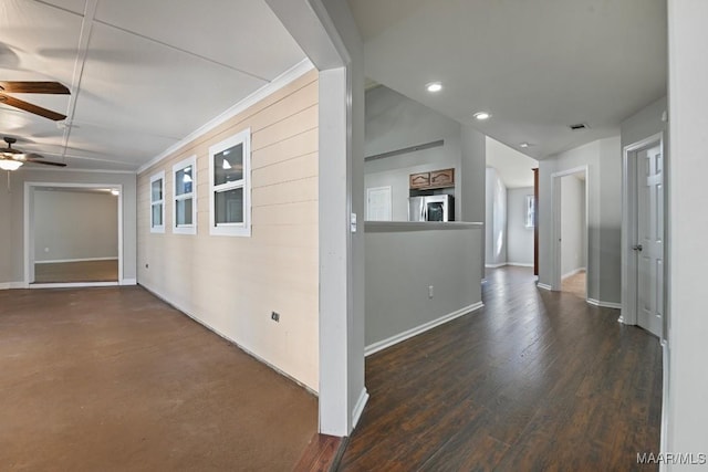 hallway featuring dark hardwood / wood-style floors and vaulted ceiling