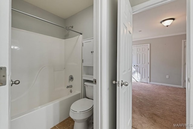 bathroom with toilet, shower / bathtub combination, and crown molding