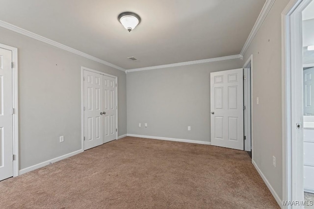 unfurnished bedroom with light colored carpet and ornamental molding