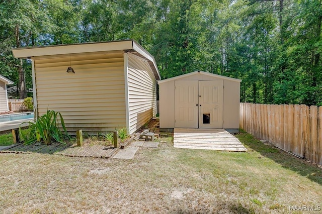 view of outdoor structure featuring a lawn